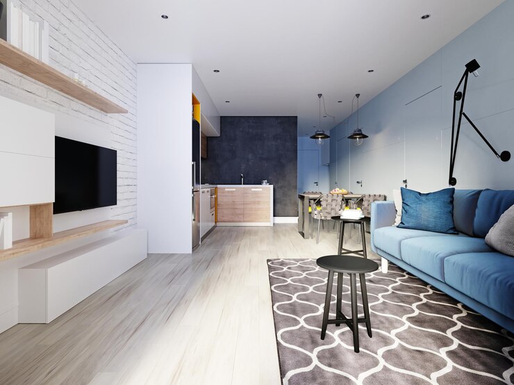 apartemen sempit dengan lantai kayu warna putih dan sofa warna biru